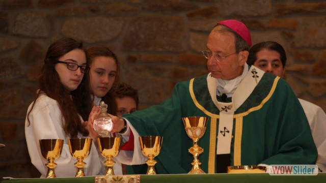 Our altar servers assisting Archbishop Lori at mass